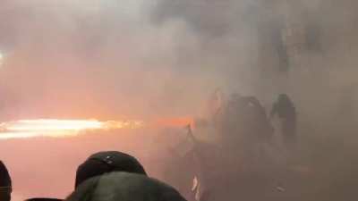 Protesters in Georgia use fireworks against water cannon