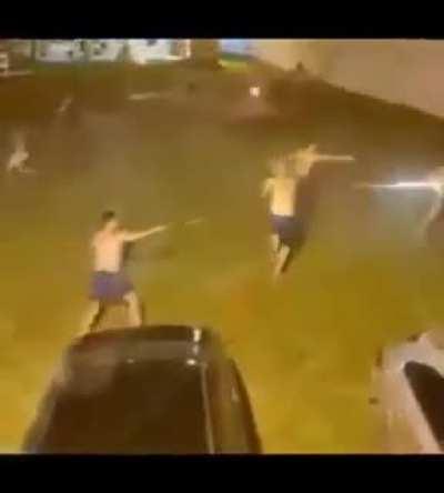 Shooting fireworks at one another... while half naked.