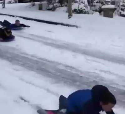 A lady called the cops on some children sledding. His response was to join them