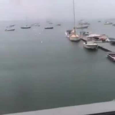 Cameraman manages to capture a boat being struck by lightning.