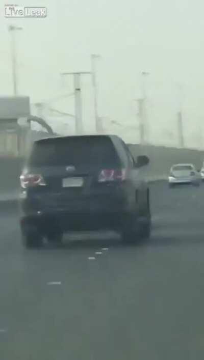 Sticking yourself out a car window to hit another car? Great idea!