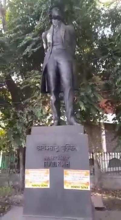 Posters put on Russian Poet Alexander Pushkin's statue at Delhi's roundabout sayings, 