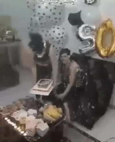 Birthday girl, a birthday cake and... fire