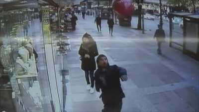 Trying to kick a balloon on the street