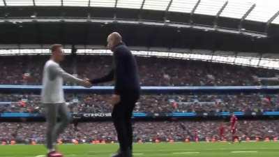 Pep Guardiola celebration in front of Liverpool substitute Kostas Tsimikas