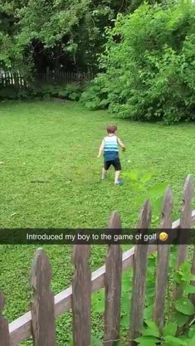 Kid tries golf