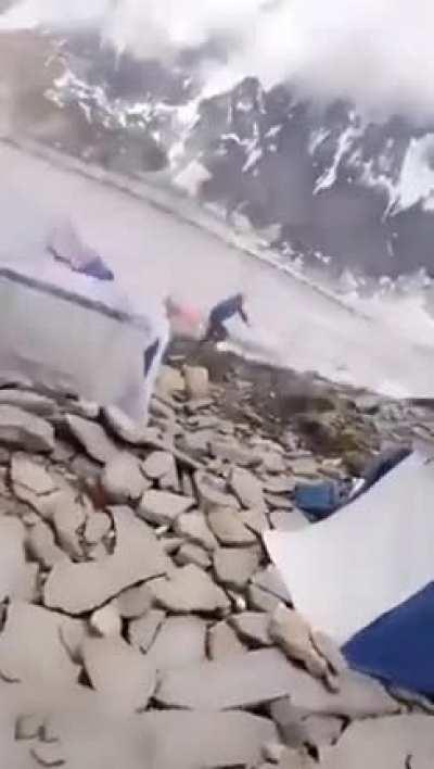 Huge rock falls down the cliff.