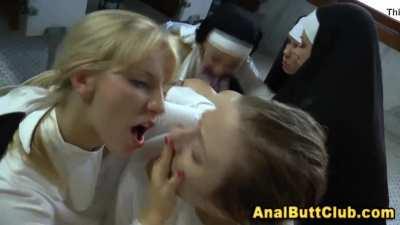 Ashley licks Chastity's face while Roxy drills the jesus dildo into her asshole