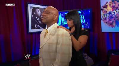 Trish Stratus catching Aksana and Teddy Long sharing a moment together