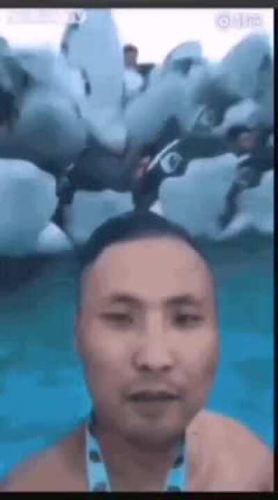 WCGW Standing in front of a bunch of floats in a wave pool