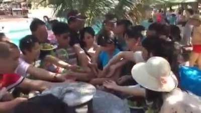 Chinese Tourists vs a plate of fruits and shrimp