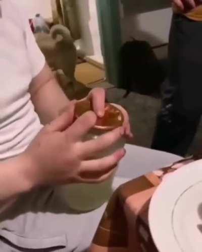 Trying to open a jar with your elbow