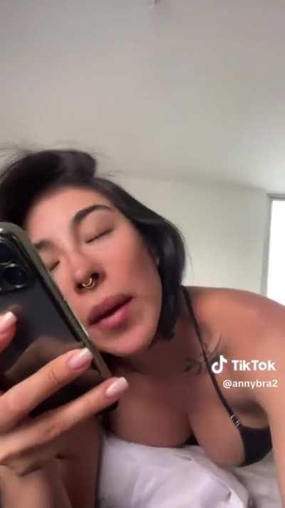 At the edge of the bed 