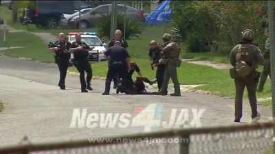 Jacksonville cop kneels on surrendered man's neck and repeatedly slams his face into the pavement.