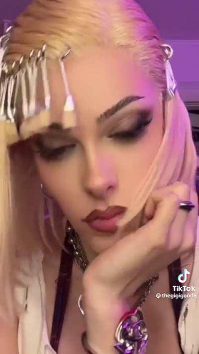 Gigi Goode showing how Goode she is at doing hair