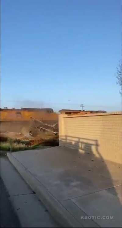 Train pulverizes a stalled out semi-truck hauling cars and SUVs. The driver escaped. You can see him running away at the beginning.
