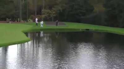 Jon Rahm skips a golf ball over water 3 times into a hole-in-one