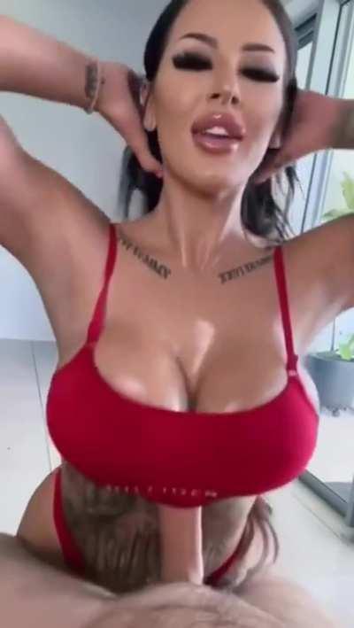 She stops rubs the cum into her tits and keeps going