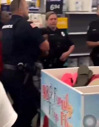 Woman tries to bite the officer and gets punched