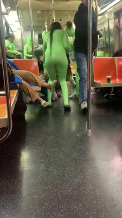 Large group of women in green suits fighting with 2 other women on N train to Astoria last night around 2am
