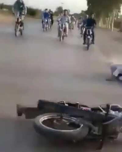 Doing a wheelie with one foot on a car