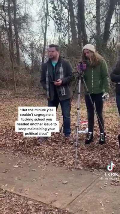 Man yelling at a girl with a tripod