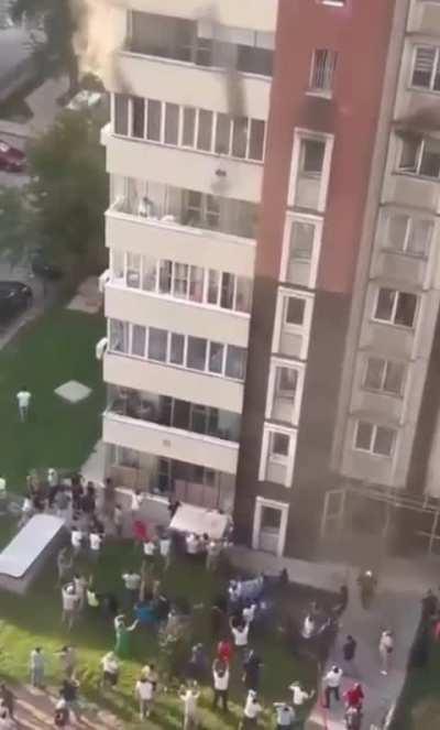 Woman throws children out of window, jumps to escape apartment building fire in Kazakhstan