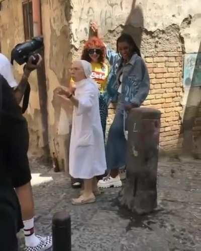 Nun pulls apart girls kissing during photo shoot in Naples