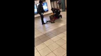 Handcuffed man kicks cops into subway tracks