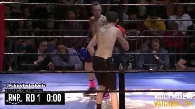 Guy slams opponent during boxing match.
