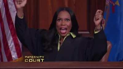 Woman cheers in joy as heartbroken man is devastated by news from the court.