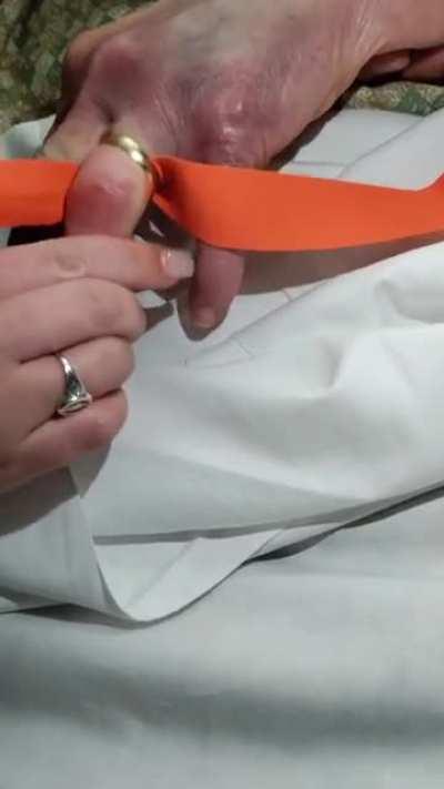 Removing a ring, that's stuck on a finger, using a tourniquet