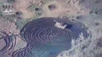 A short video of a screen showing a Russian tank driving circles, presumably because the crew is not alive.