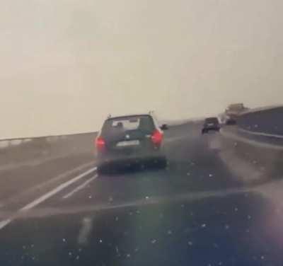 Truck jumps into car