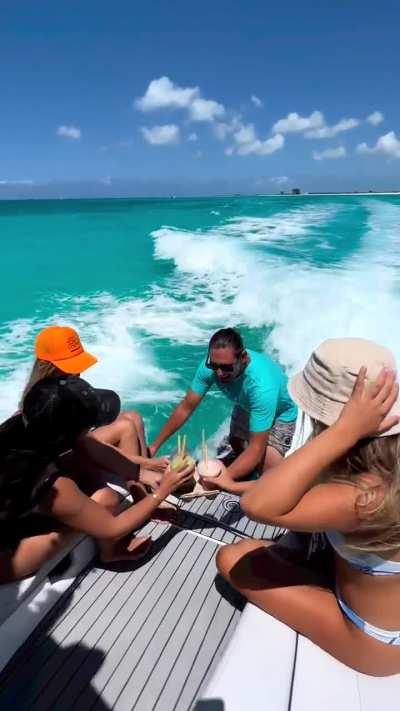 Wakeboarder delivers drinks for the ladies 