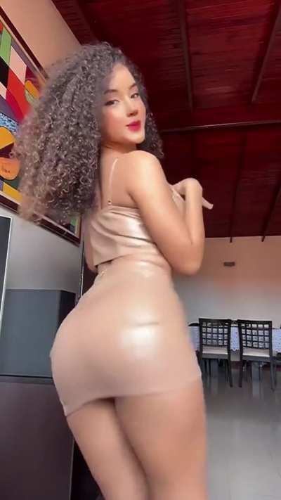 Sexy woman in a sexy leather mini skirt