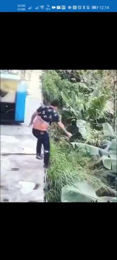 Man tries to pee by the side of the road, falls