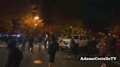 Shots fired as armed, black-clad mob attack man's truck (random truck-on-truck combat at the end)