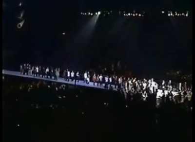 Fans piling up to get slapped by Antonio Inoki