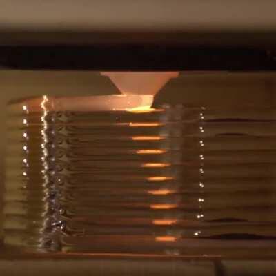 My molten glass 3D printer (5mm layers and the lead in/out is real juicy)