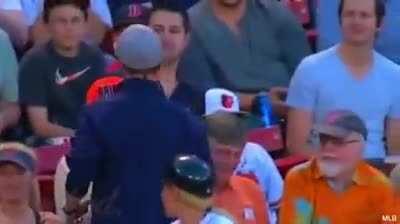 A foul ball was given to a young teenager in the audience then he kindly give it away to a little boy.
