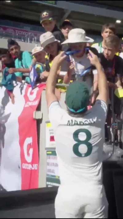 Marsh steals a medal from a kid and moonwalks away!