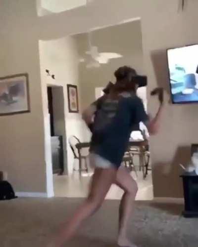 Apparently whatever game she is playing has a key for headbutt attack.