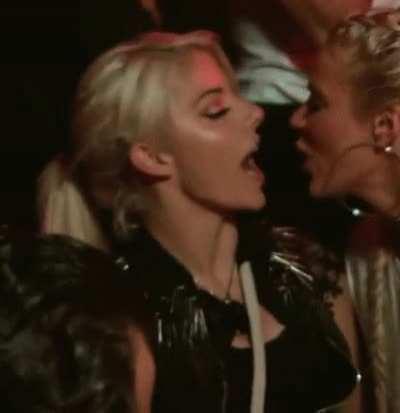 Alexa Bliss kissing CJ Perry