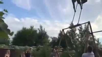 messing around on a kids swing