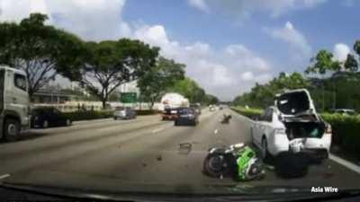 Motorcycle passenger catapulted 65 feet through the air after slamming into a stationary vehicle