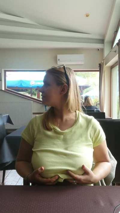 There is a lively discussion behind me about what to choose from the menu, and I have already chosen and am now just showing off my big boobs. Heh