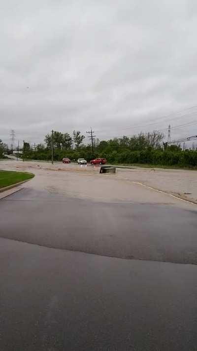 Dumpster floating down Windisch Rd in West Chester