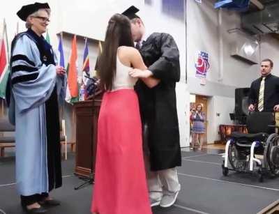 She helped her paralyzed boyfriend stand up to get his degree