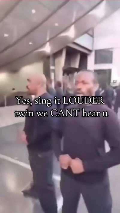 A group of people singing Kanye West’s new song